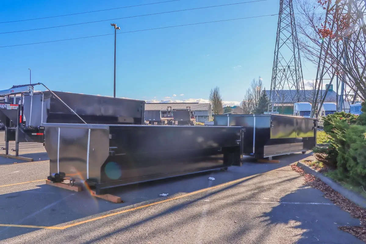 Roll-off dumpster ready for waste disposal at job site for Yard Waste Dumpster Rental in Norwich